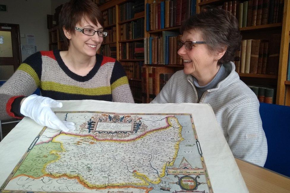 Emily Tillett and Sarah Steggles with Saxton's 1575 Map of Suffolk