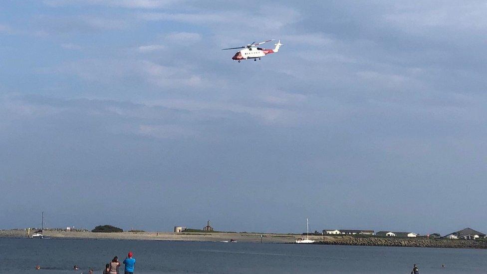 A helicopter, part of the emergency team involved