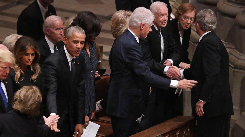 At the funeral of George Bush Sr