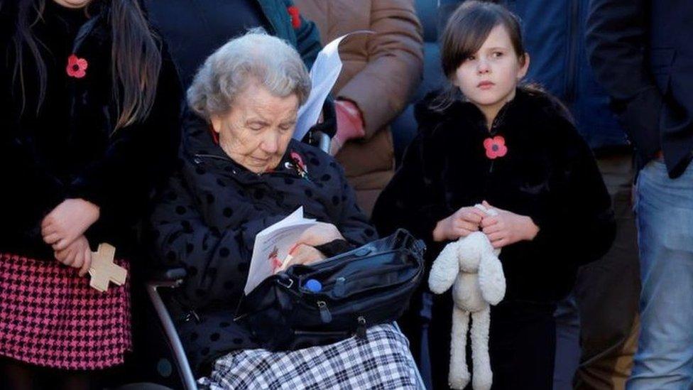 Members of the public observed the silence at the Scott Monument in Princes Street Gardens, Edinburgh