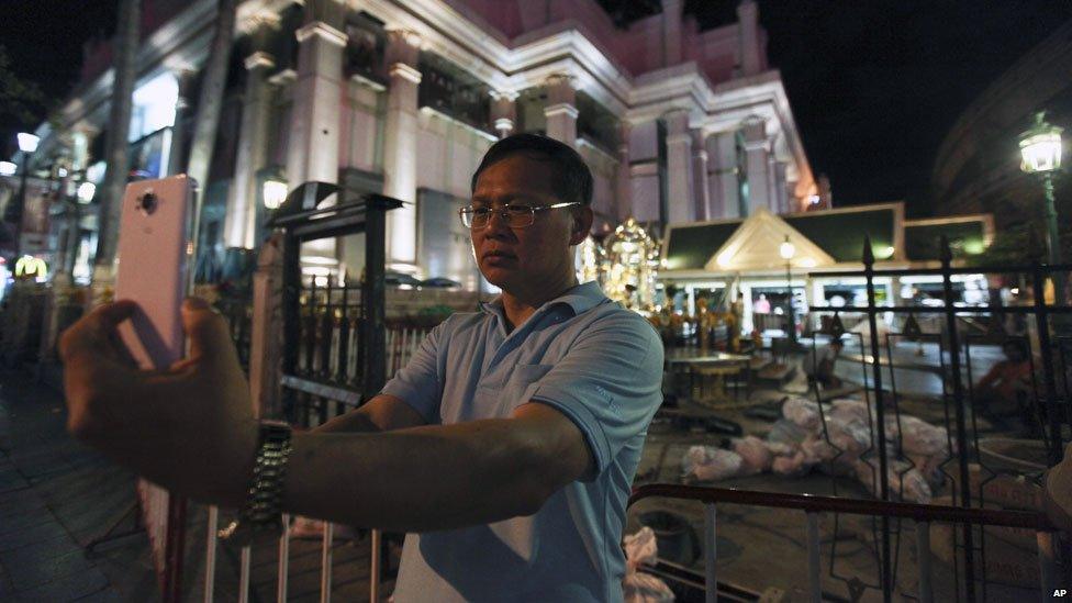 Man taking selfie at Erawan shrine