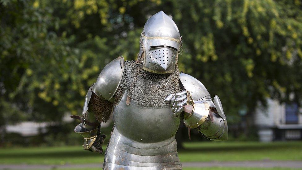 A photo of Sir Runalot jogging in full armour.