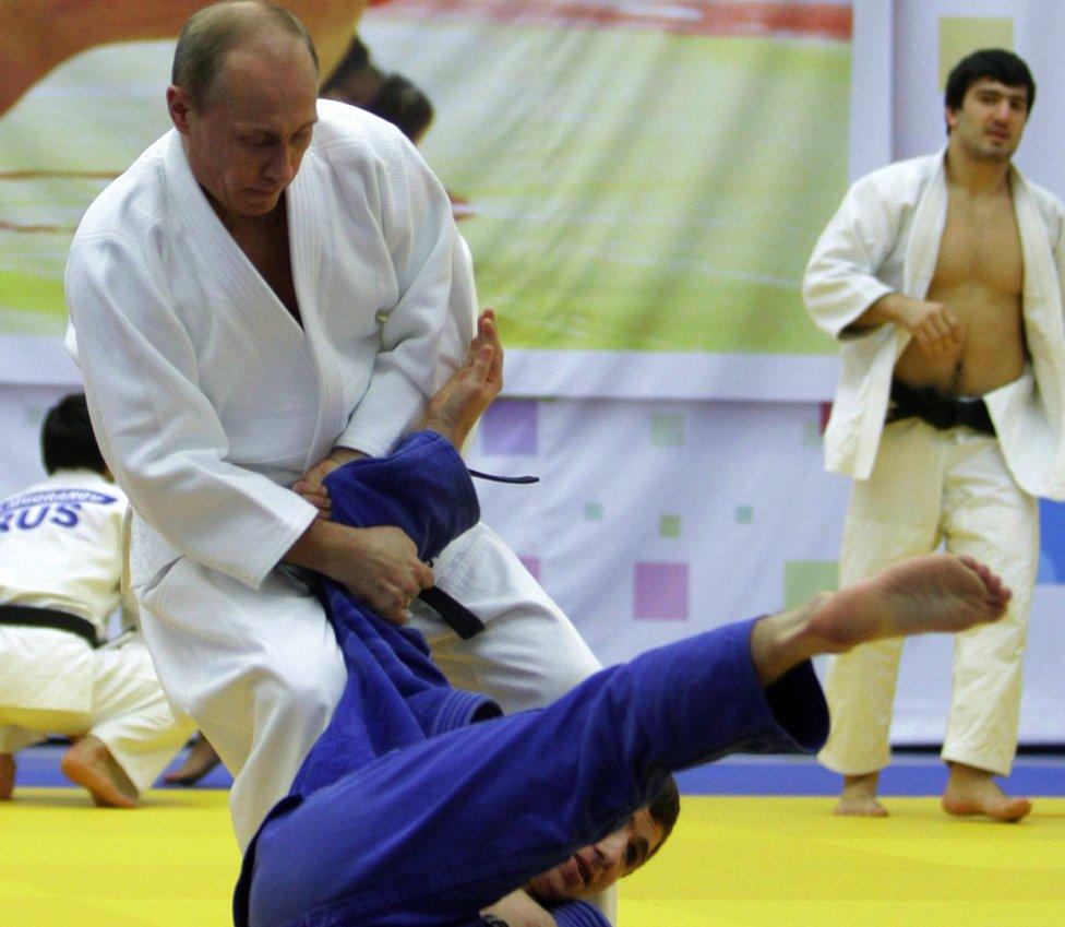 Russia's then Prime Minister (now President) Vladimir Putin (standing) in judo bout at sports complex in St Petersburg, 22 Dec 10