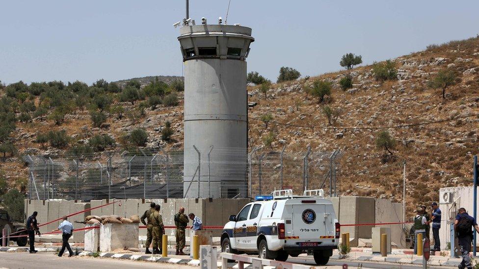 Israeli security forces at the scene where a Palestinian woman was shot dead