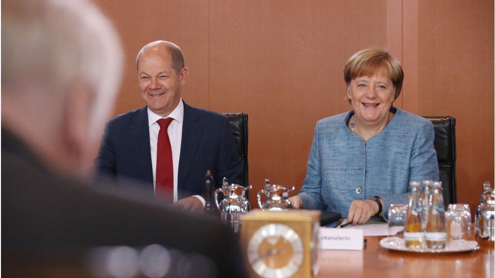 Olaf Scholz and Angela Merkel