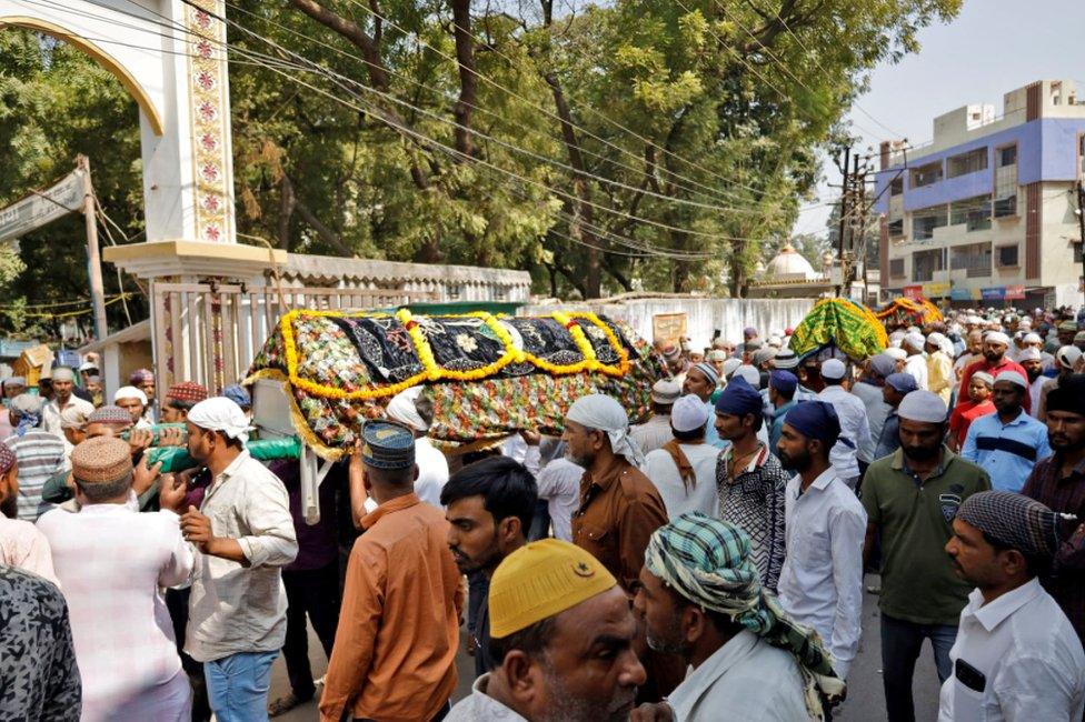 People carry coffins containing the bodies of the victims for their burial after a suspension bridge collapsed in Morbi town in the western state of Gujarat, India, October 31, 2022.