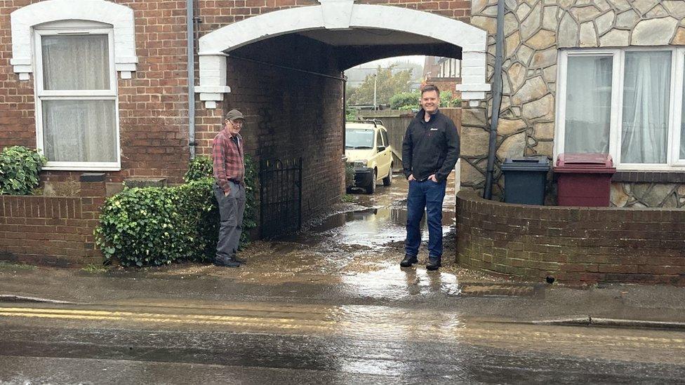 Residents stood by puddle of water in reading