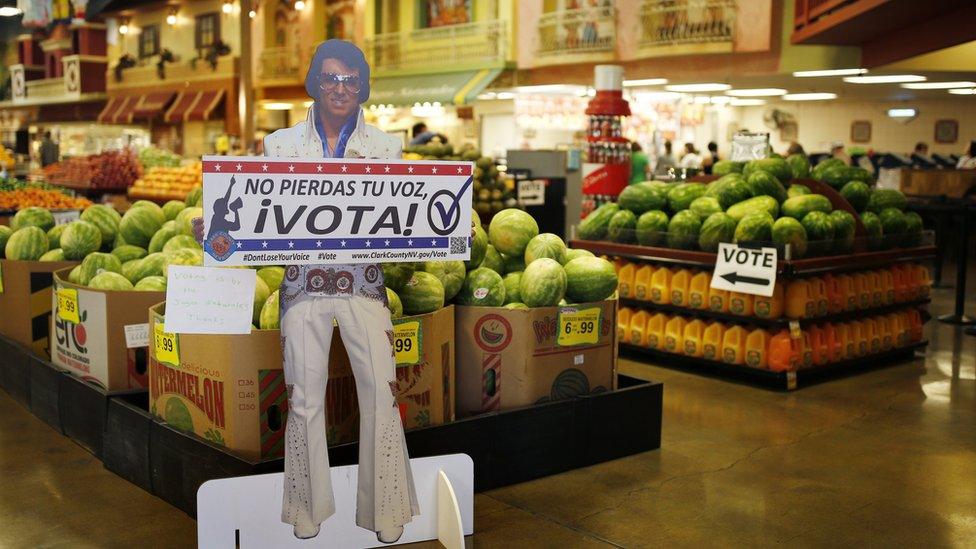 -A sign in Spanish which translates, "Don"t Lose Your Voice, Vote!" is displayed near a polling place in a Cardenas supermarket in Las Vegas on Friday, June 10, 2016.