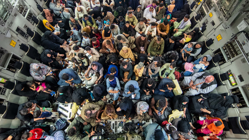 People sat in a military plane