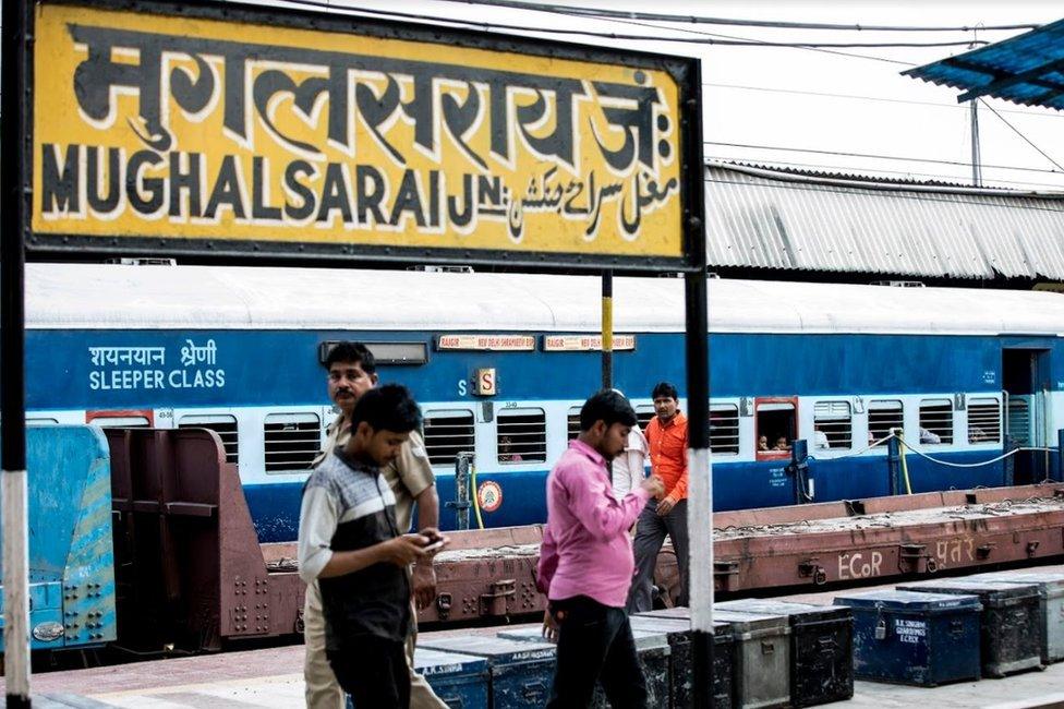 People at the Mughalsarai station platform waiting for their train