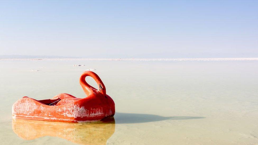 a pleasure boat in very shallow water