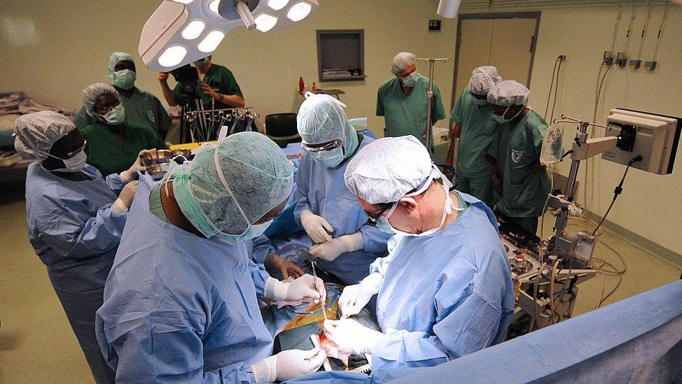 surgeons in operating theatre