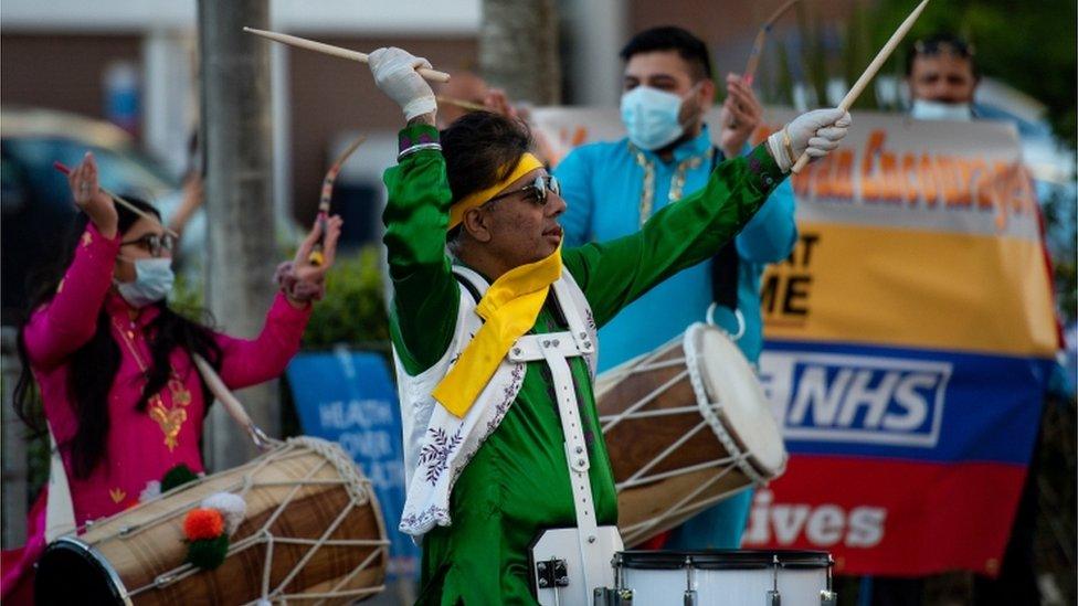 These traditional drummers in Birmingham played music and rhythms to salute the doctors, nurses and staff at their local hospital