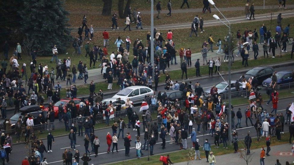 People attend an opposition rally to reject the presidential election results in Minsk