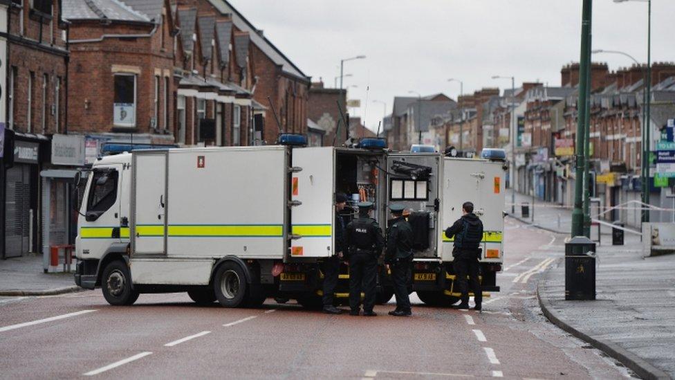 Police and bomb disposal officers at the scene of the bomb