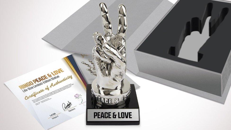 Stainless steel statue with certificate and box