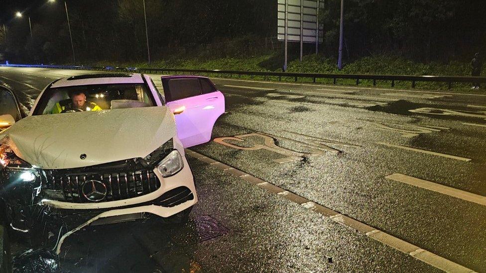 White Mercedes car damaged by collision