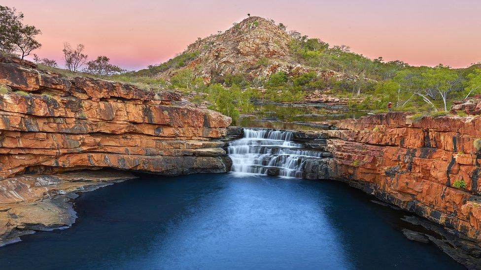 Water flows over the Bell Creek Falls