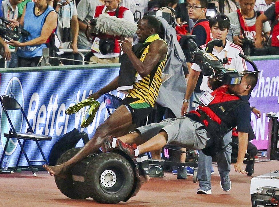 Usain Bolt is floored by a cameraman on a segway