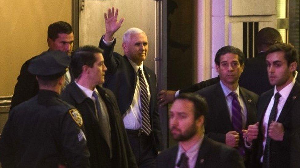 Vice President-elect Mike Pence, top centre, leaves the Richard Rodgers Theatre after a performance of "Hamilton," in New York, Friday, Nov. 18, 2016.