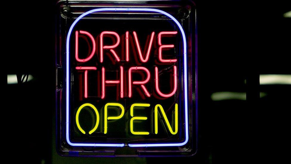 a drive-thru neon sign