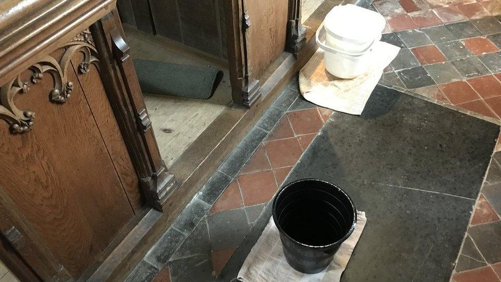 Bucket on a church floor