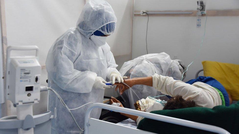 Health care worker treats a patient in Tunisia