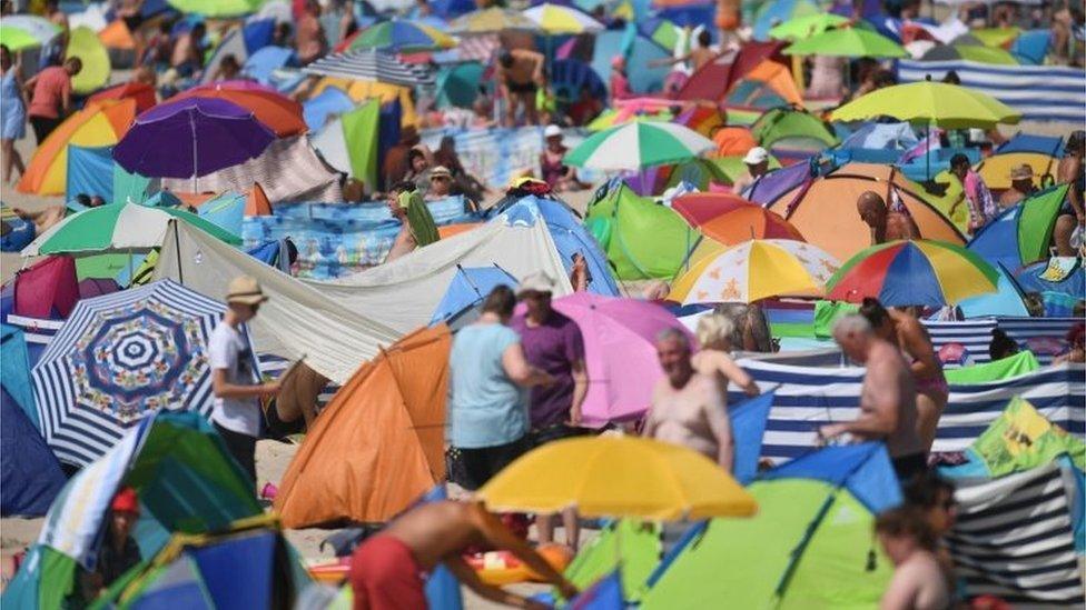 People crowded on to the beach at Zinnowitz on the island of Usedom in the Baltic Sea, northern Germany