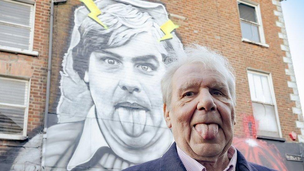 Terri Holey at belfast mural in his honour