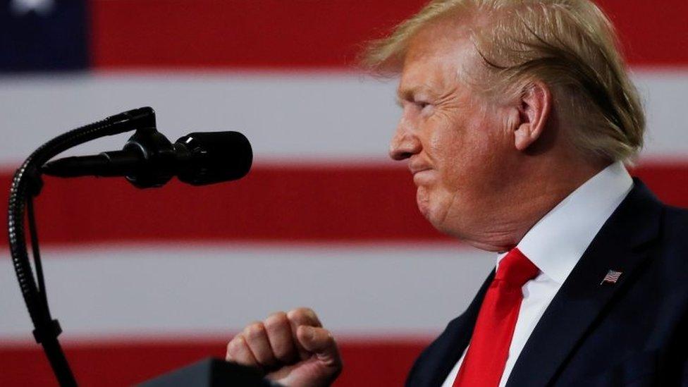 U.S. President Donald Trump pumps his fist as he delivers remarks on supporting the passage of the U.S.-Mexico-Canada