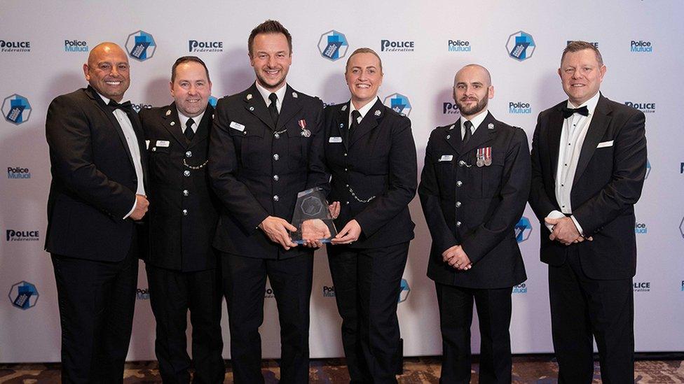 Officers receiving their award