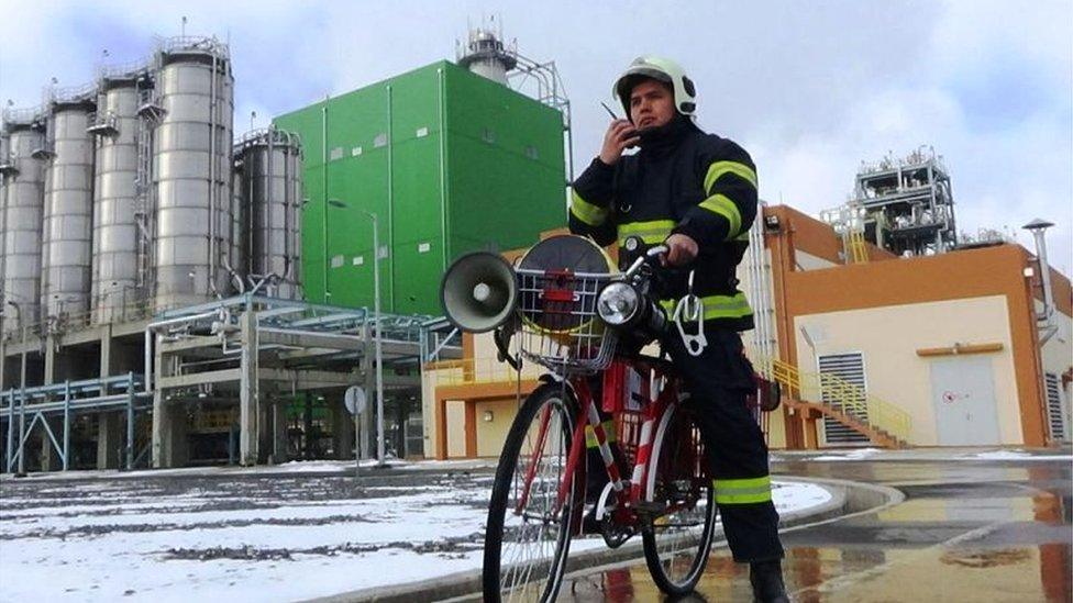 A fire-fighter demonstrates the new bike