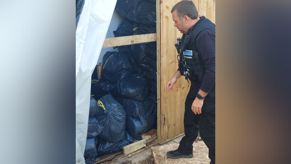 Officers entering the factory