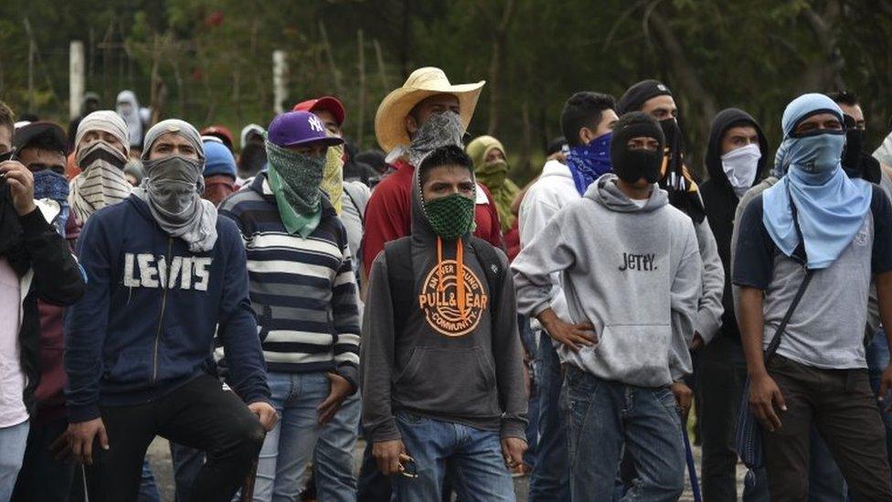 Student teachers from Ayotzinapa angry for the disappearance of 43 students are pictured during clashes with the riot police along the Tixtla-Chilpancingo highway in Tixtla, Guerrero State, Mexico, on September 22, 2015.