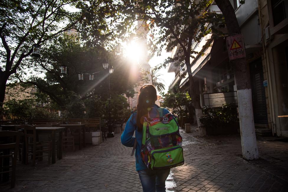 Reem,11 is walking early in the morning in order to reach the public school she and her siblings are attending for the past year in the city of Chania.