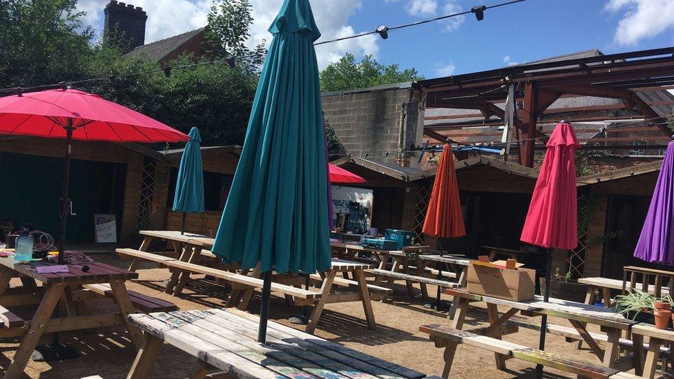 Seating area at Electric Daisy community garden