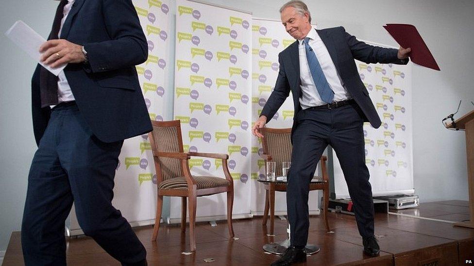 Tony Blair leaving the stage after delivering a speech in London