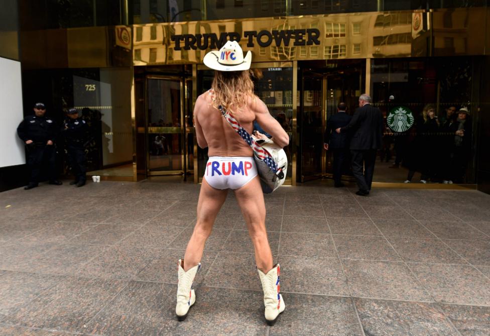 Robert John Burck, better known as the Naked Cowboy, performs in front of Trump Tower in New York - 25 October 25, 2016