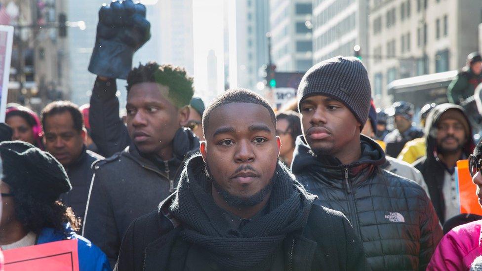 Demonstrators calling for an end to gun violence and the resignation of Chicago Mayor Rahm Emanuel march through downtown on December 31, 2015 in Chicago, Illinois.