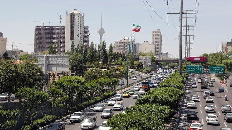 File photo shows a traffic jam in downtown Tehran on 27 April 2016