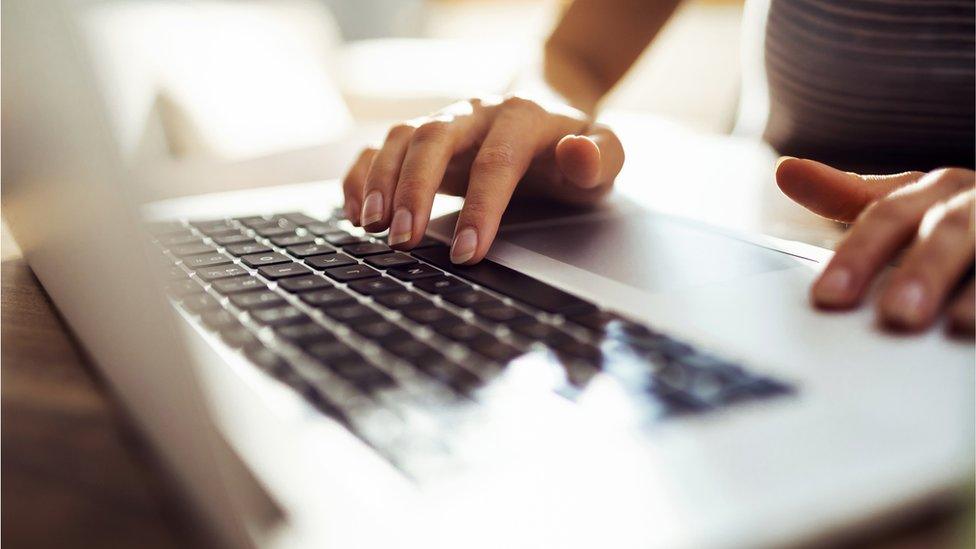 Young woman using laptop