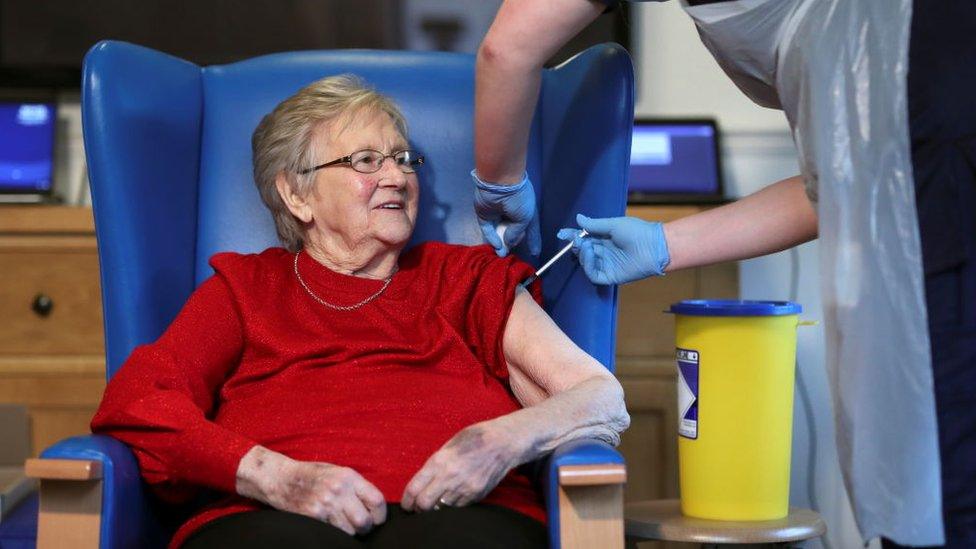 Resident Annie Innes, 90, receives the Pfizer/BioNTech COVID-19 vaccine at the Abercorn House Care Home on December 14, 2020 in Hamilton, Scotland