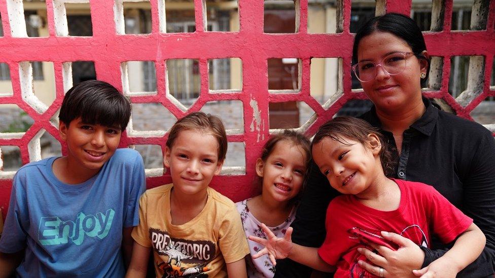 Angie Fuentes, a resident of the Ecuadorian city of Duran, with her four children.