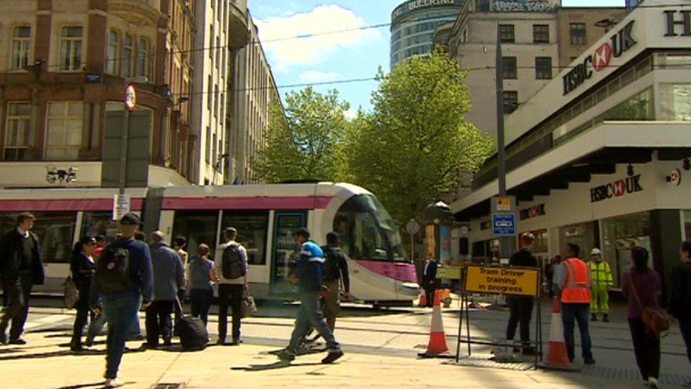 Tram running through Corporation Street, Birmingham