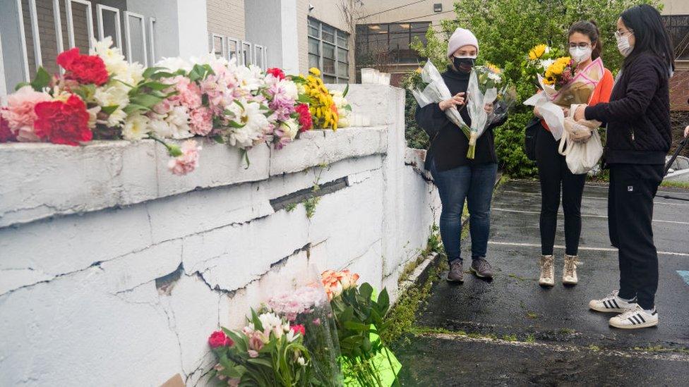 A memorial for the victims outside Young's Asian Spa