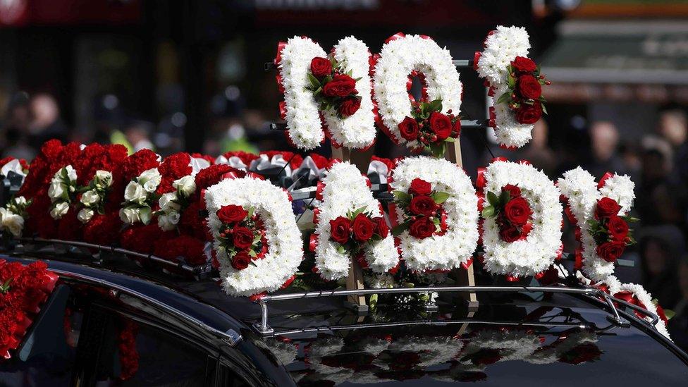 The flowers on the hearse spell out "NO 1 DADDY."