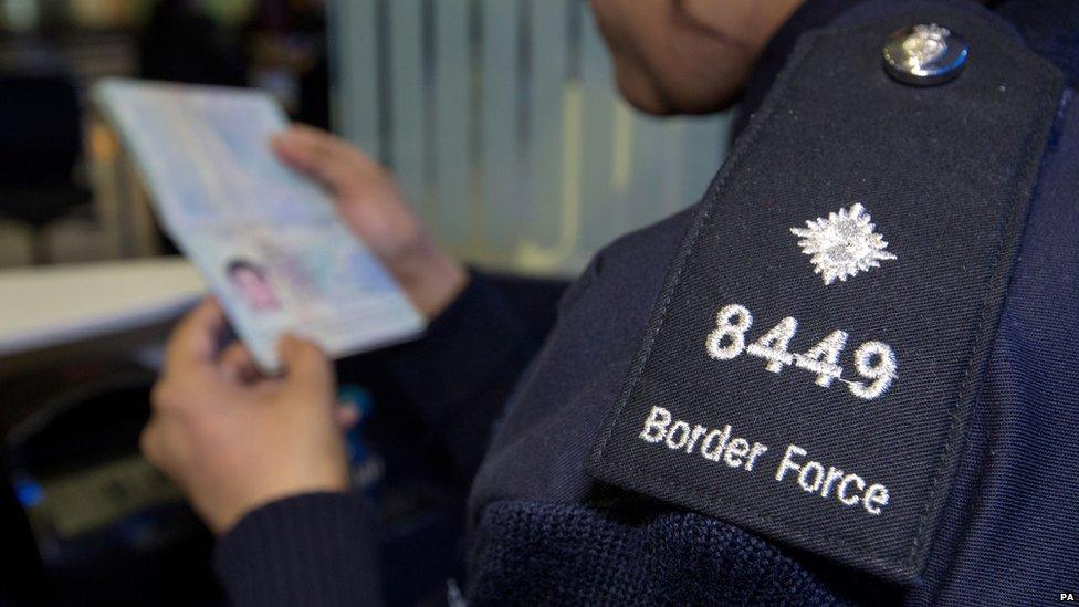 Border control staff at Heathrow Airport