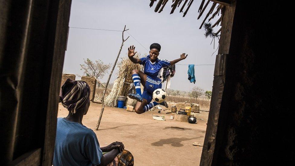 girl-playing-football.
