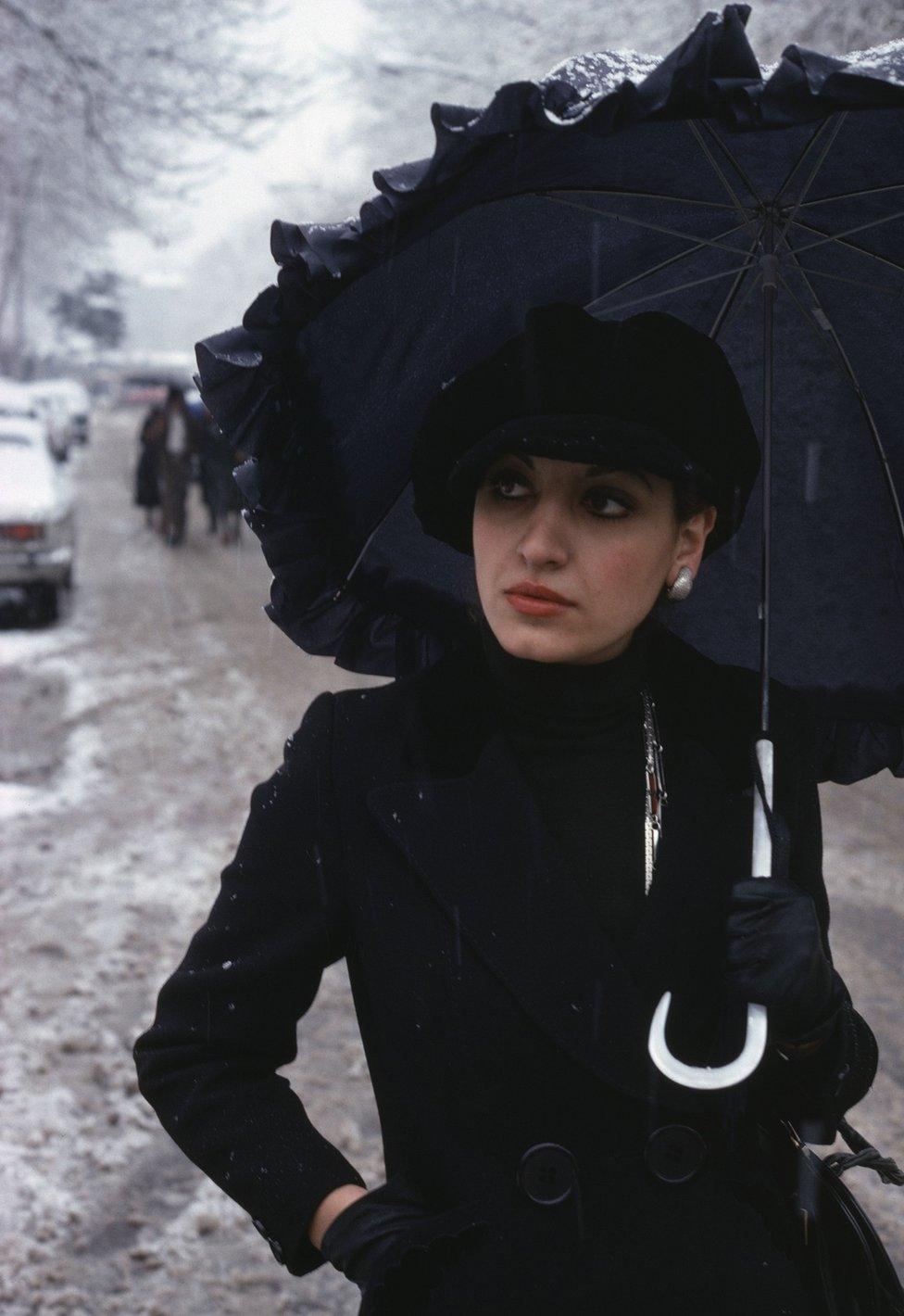 Stylish student walks in the snow in Tehran in 1976