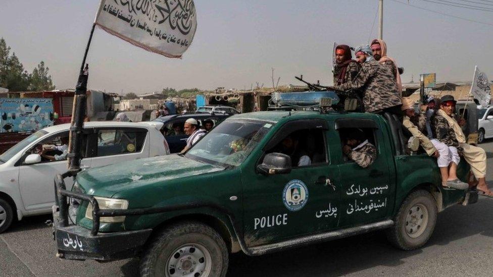 Armed Taliban fighters on patrol